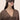 Woman wearing a brown sleep mask against a beige background | One of a Kin