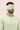 Man wearing a light green sleep mask against a pink background | One of a Kin